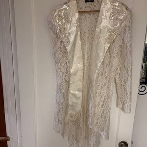 Vintage laced overcoat with sequin appliqué.